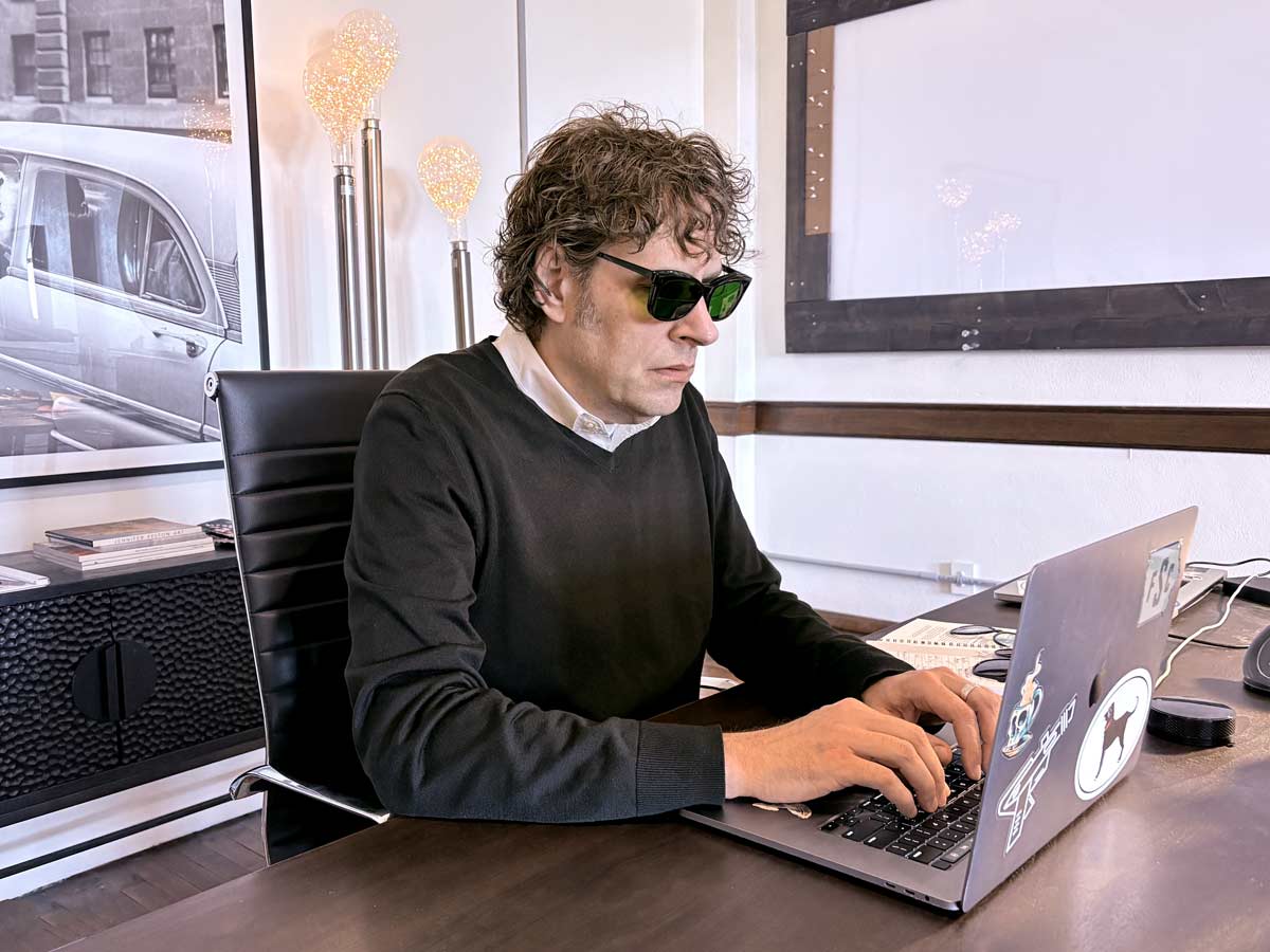 A man using glasses that filter narrow band green light filter