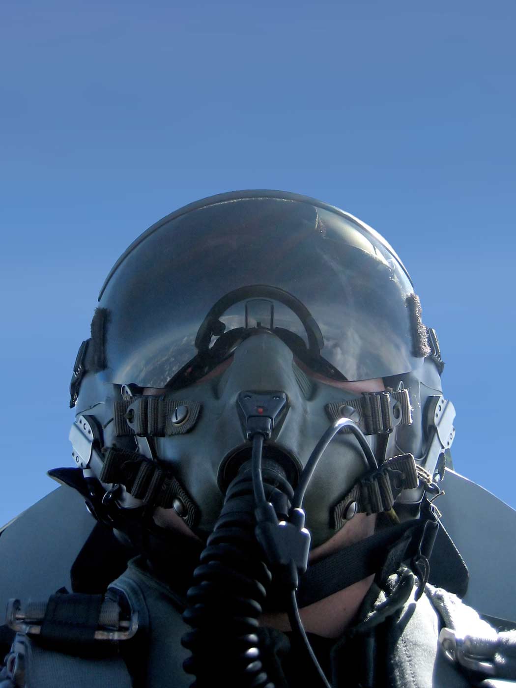 A fighter pilot in a cockpit.